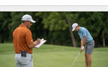 Golf coach watching a junior golfer hit a wedge shot