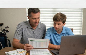 Parent and junior golfer reviewing costs and scorecards