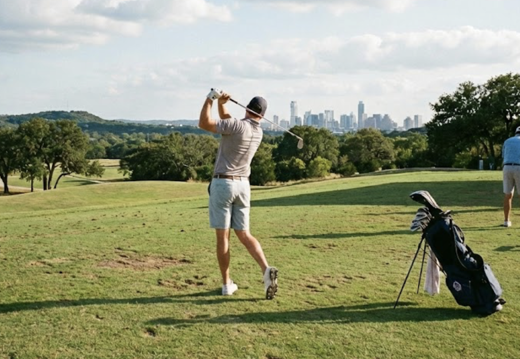 Golfer on a structured practice session at an Austin driving range with target flags in the distance