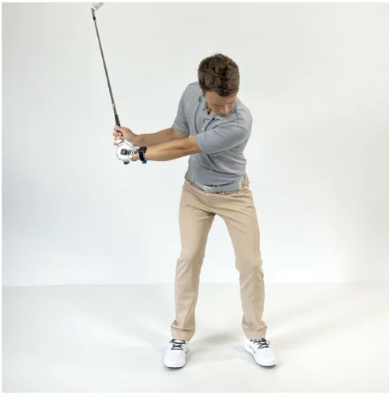 Golfer showing lead leg vertical force at P5 with preserved spine angle through impact