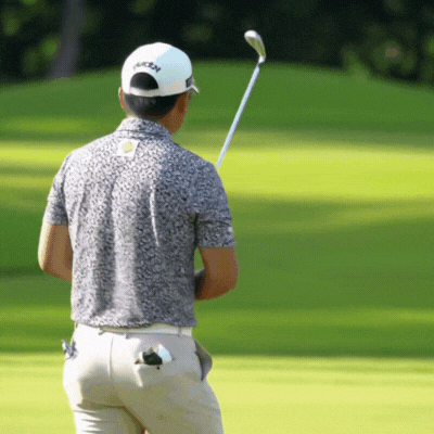 Golfer setting up with proper posture and alignment
