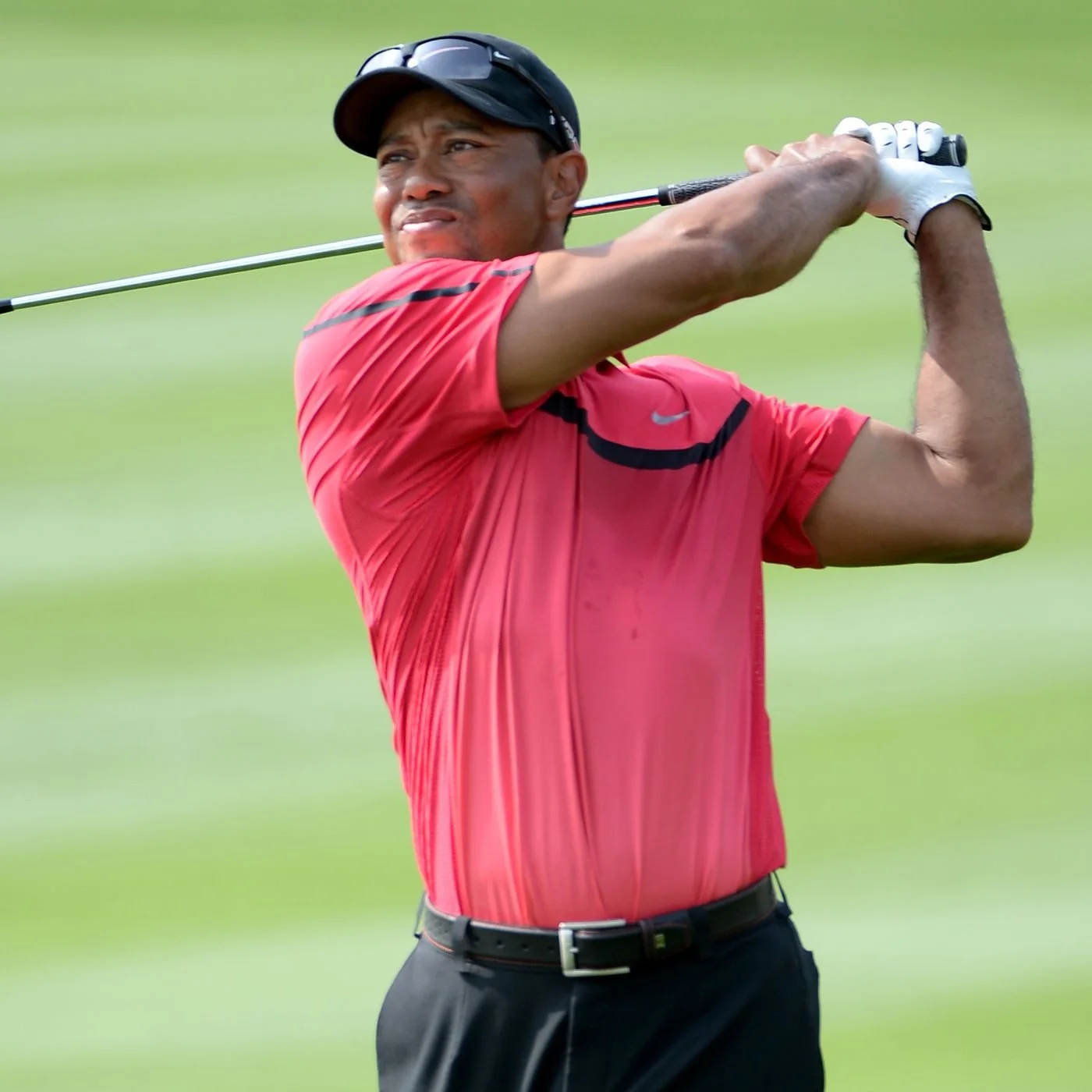 Tiger Woods golf swing follow-through showing swing change process